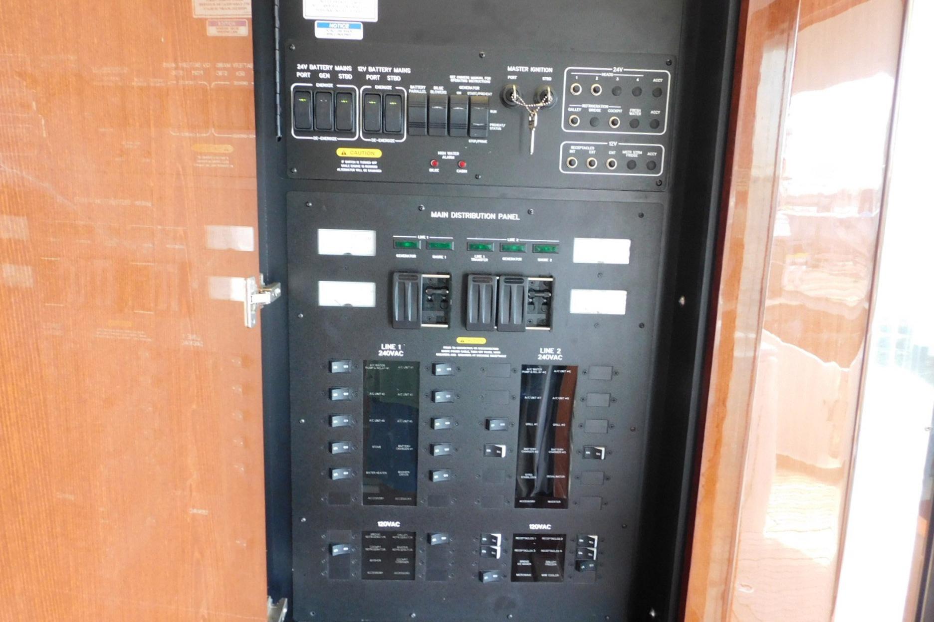 Electrical control panel inside a 2019 Sea Ray L550 yacht, featuring various switches and indicators.