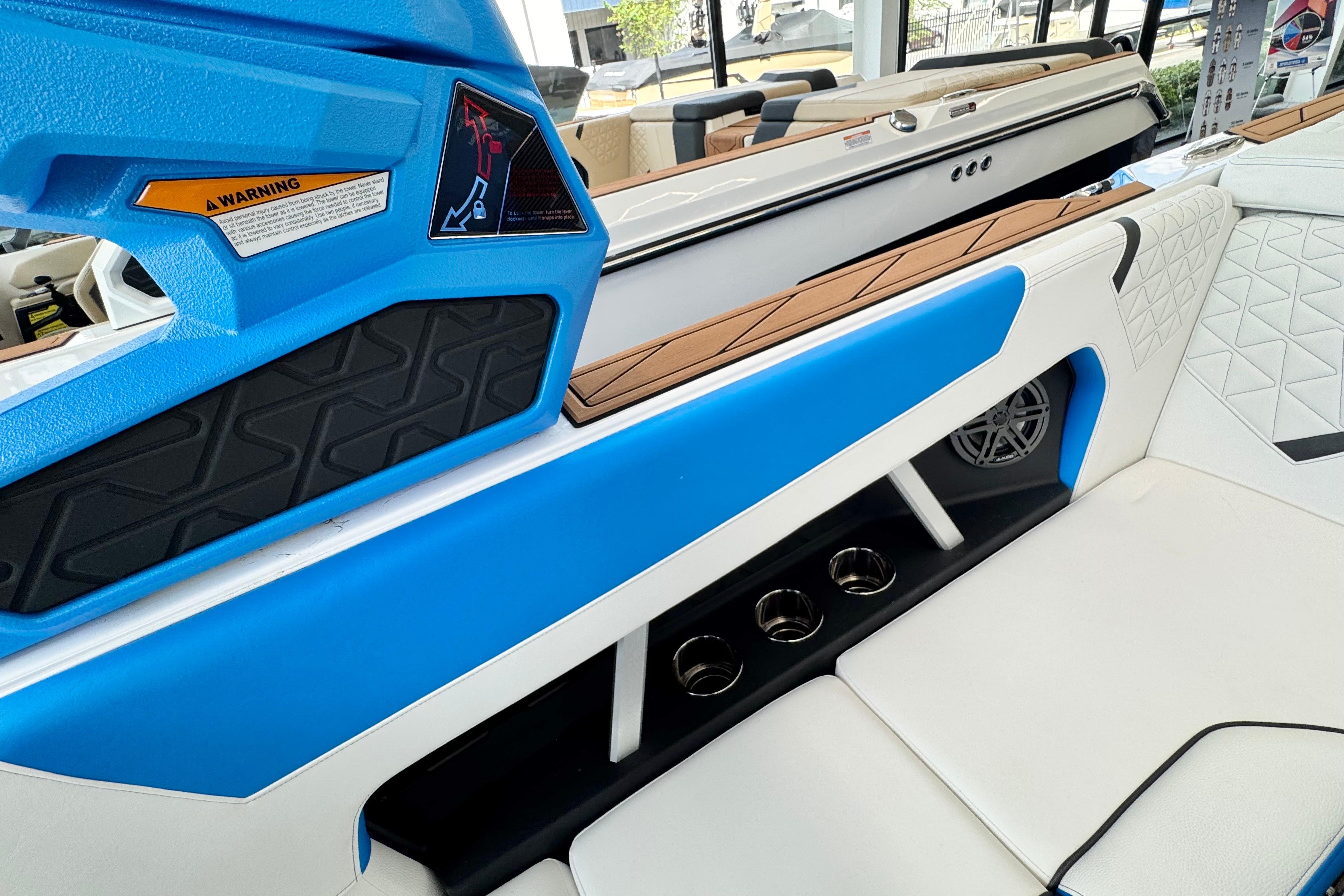2026 Nautique Super Air Nautique GS22 interior with blue accents and cup holders.