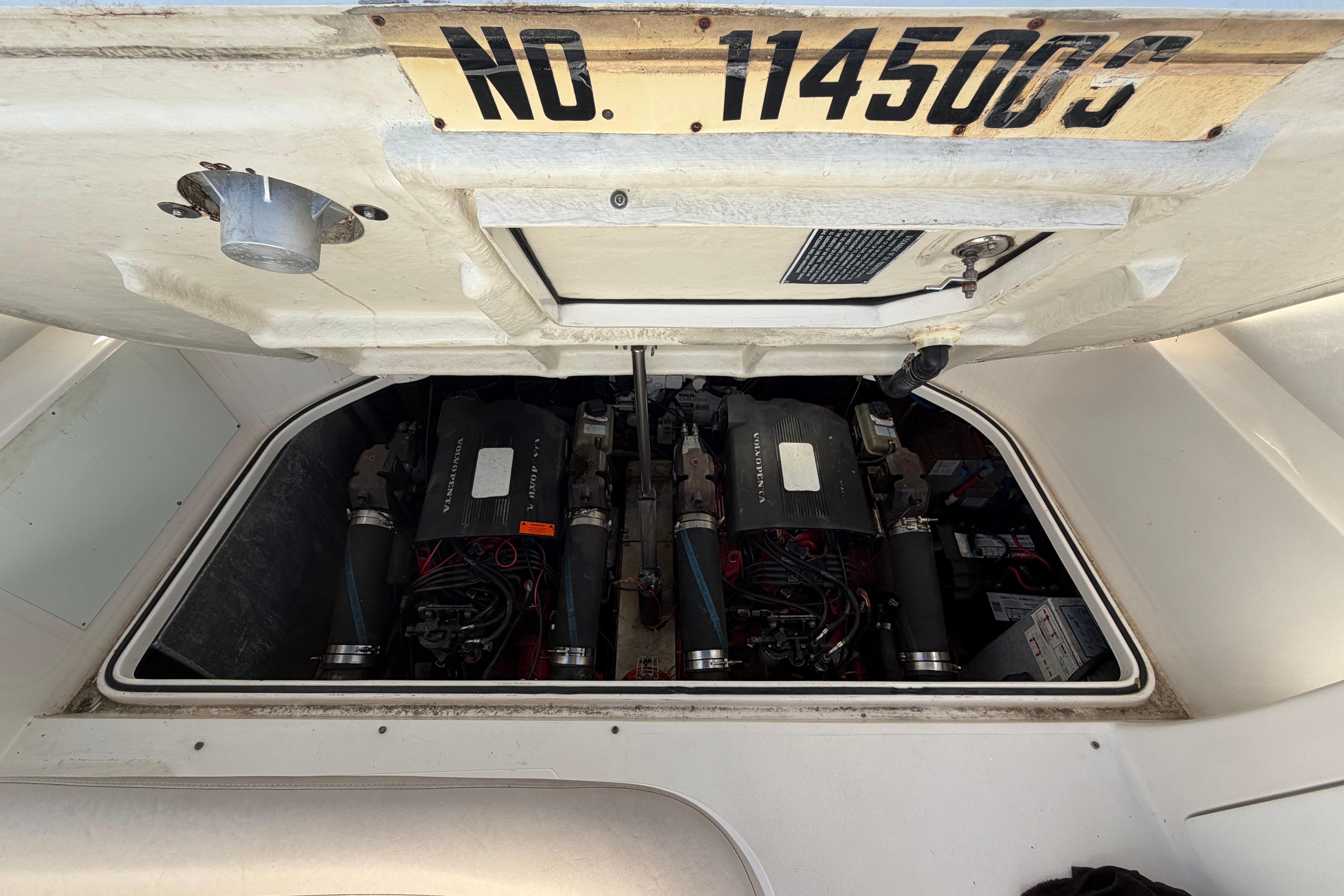 Engine compartment of a 2003 Regal Commodore 3260 boat, showcasing dual engines.