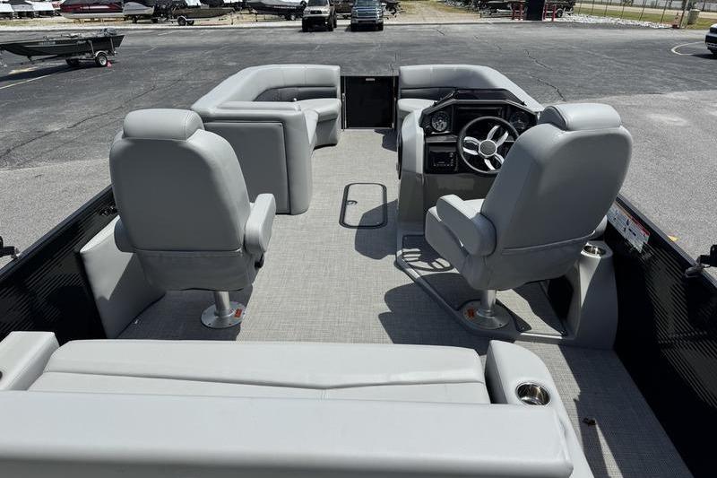 2026 Manitou Encore 25 SL SHP pontoon boat interior with gray seating and steering console.