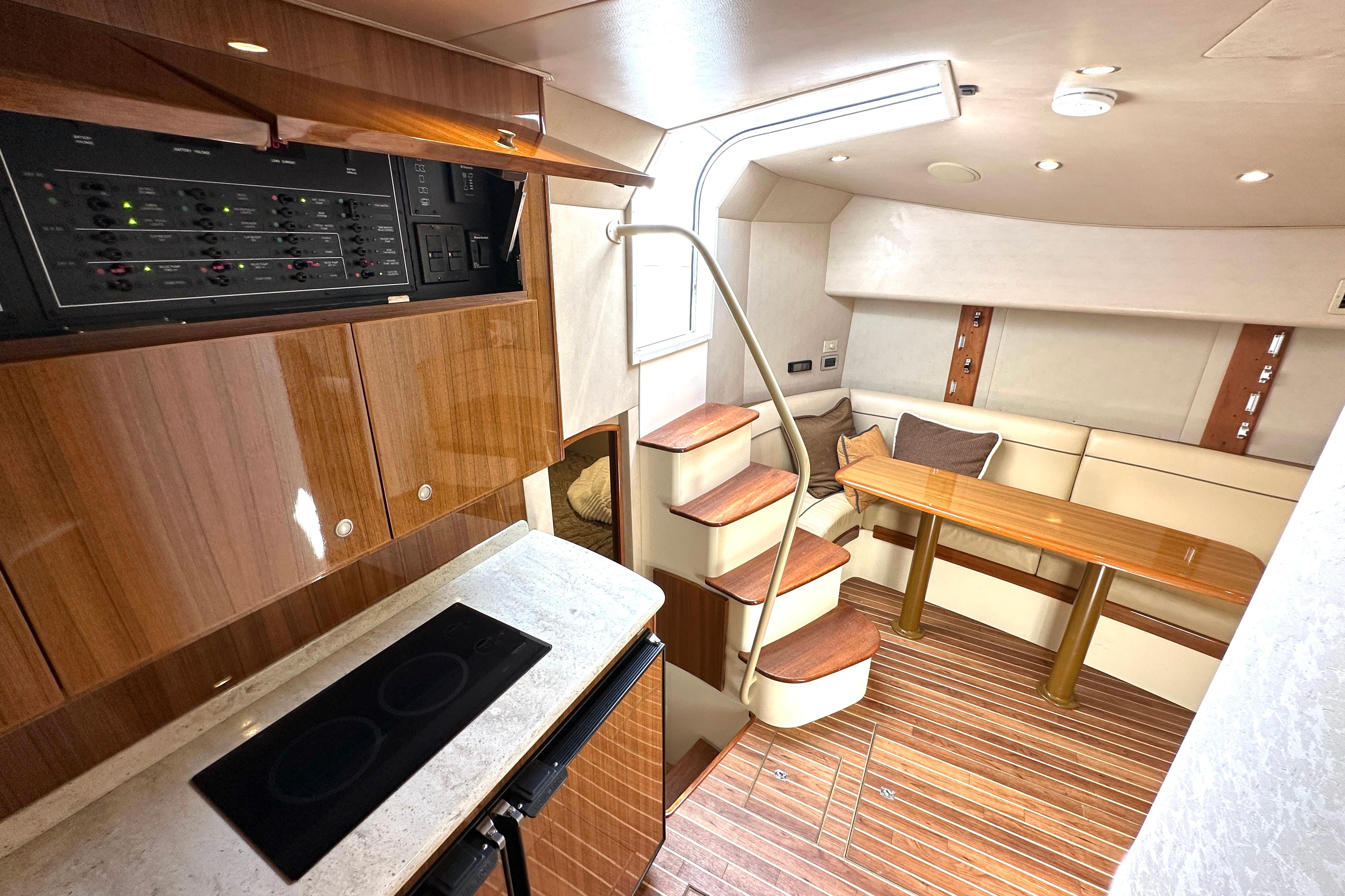 Luxurious interior of 2012 Viking 42 Open yacht with modern kitchen and cozy seating area.