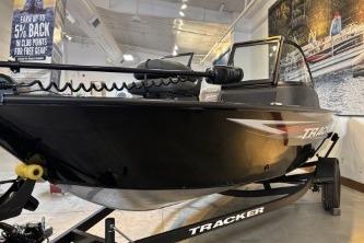 2026 Tracker Pro Guide V-16 WT boat displayed indoors on a trailer.