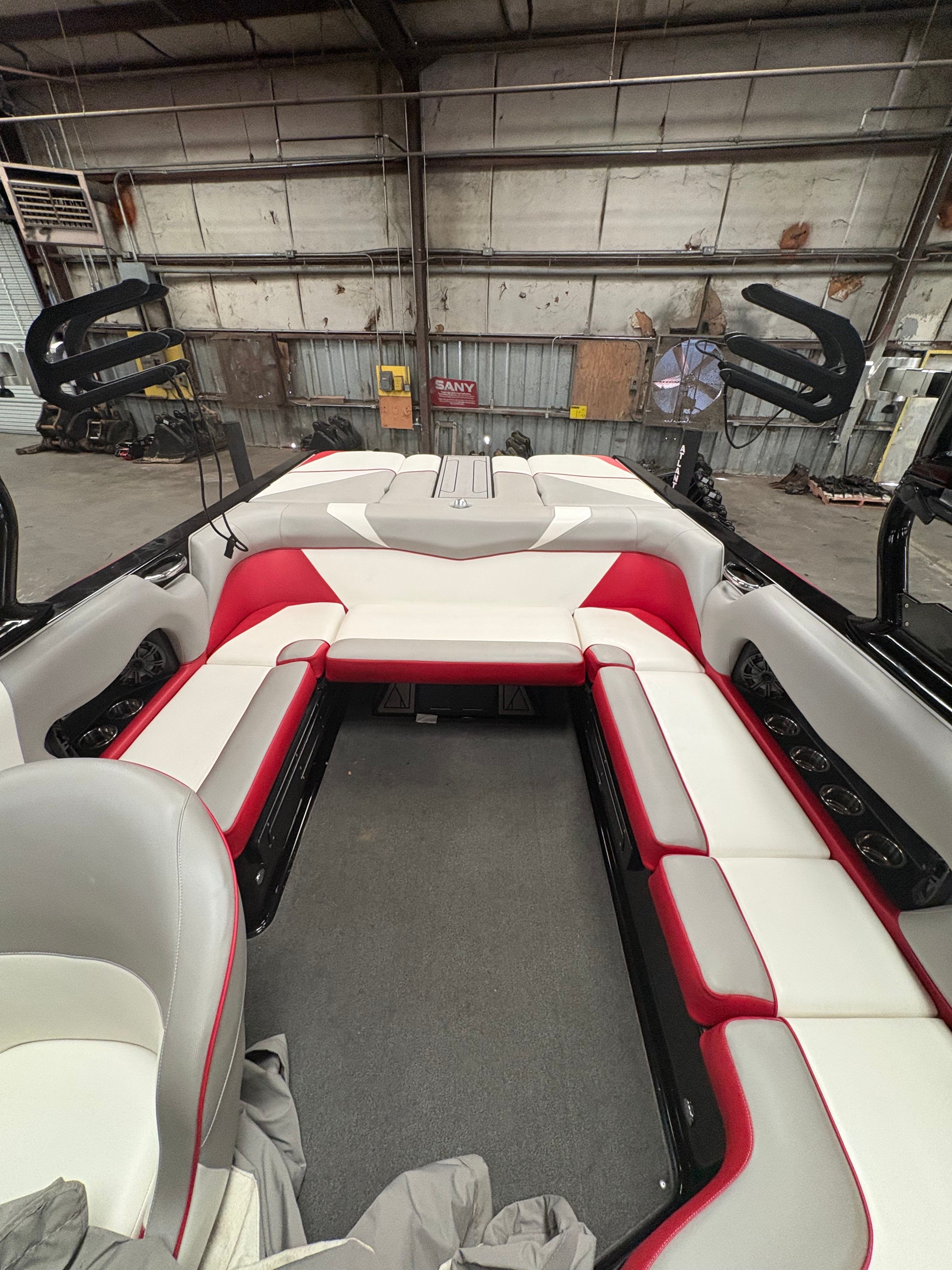 Interior of a 2019 Moomba Craz boat with red and white seating.