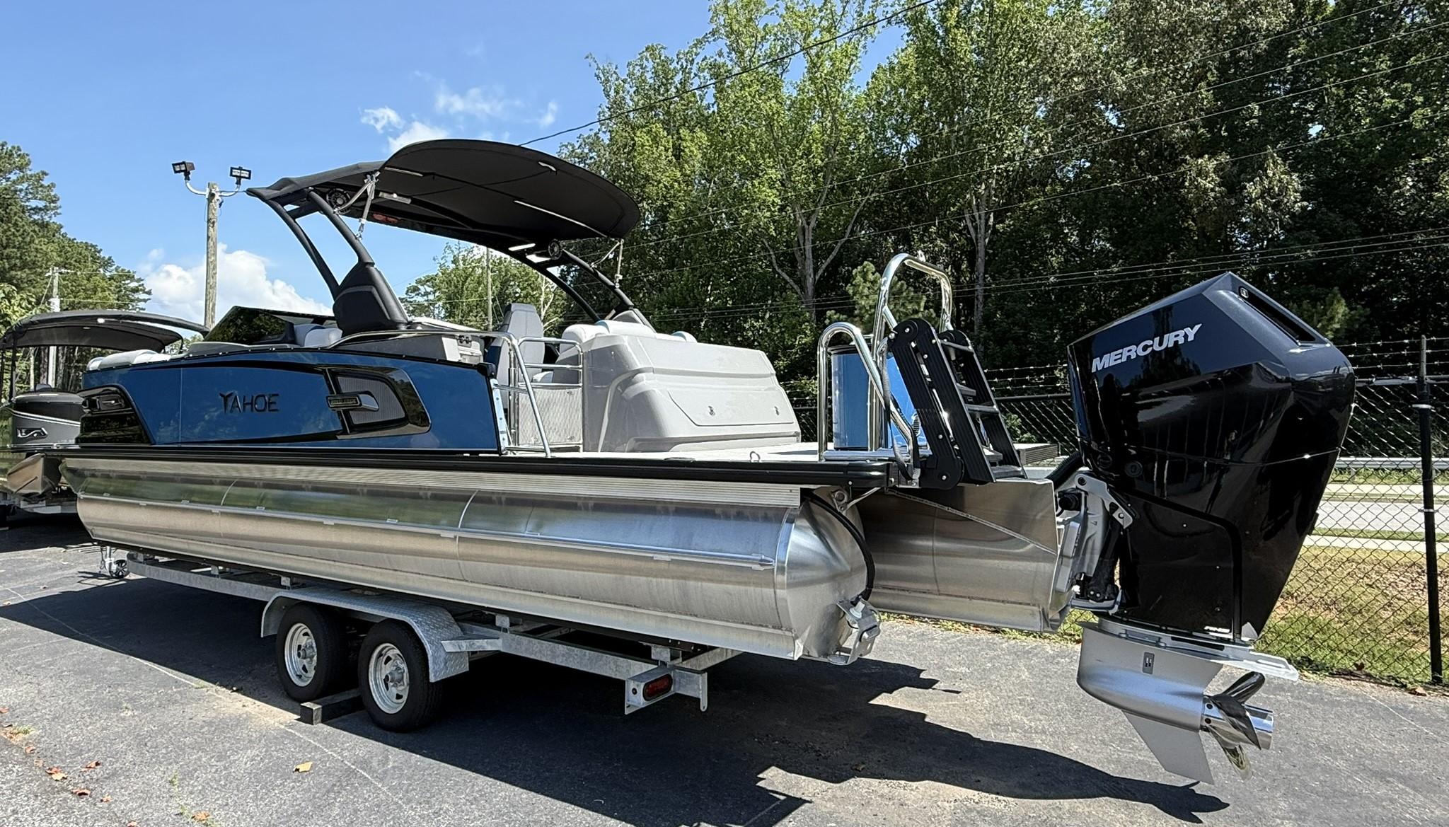 2025 Tahoe Pontoon Grand Tahoe Elite Windshield on trailer, featuring Mercury outboard motor.