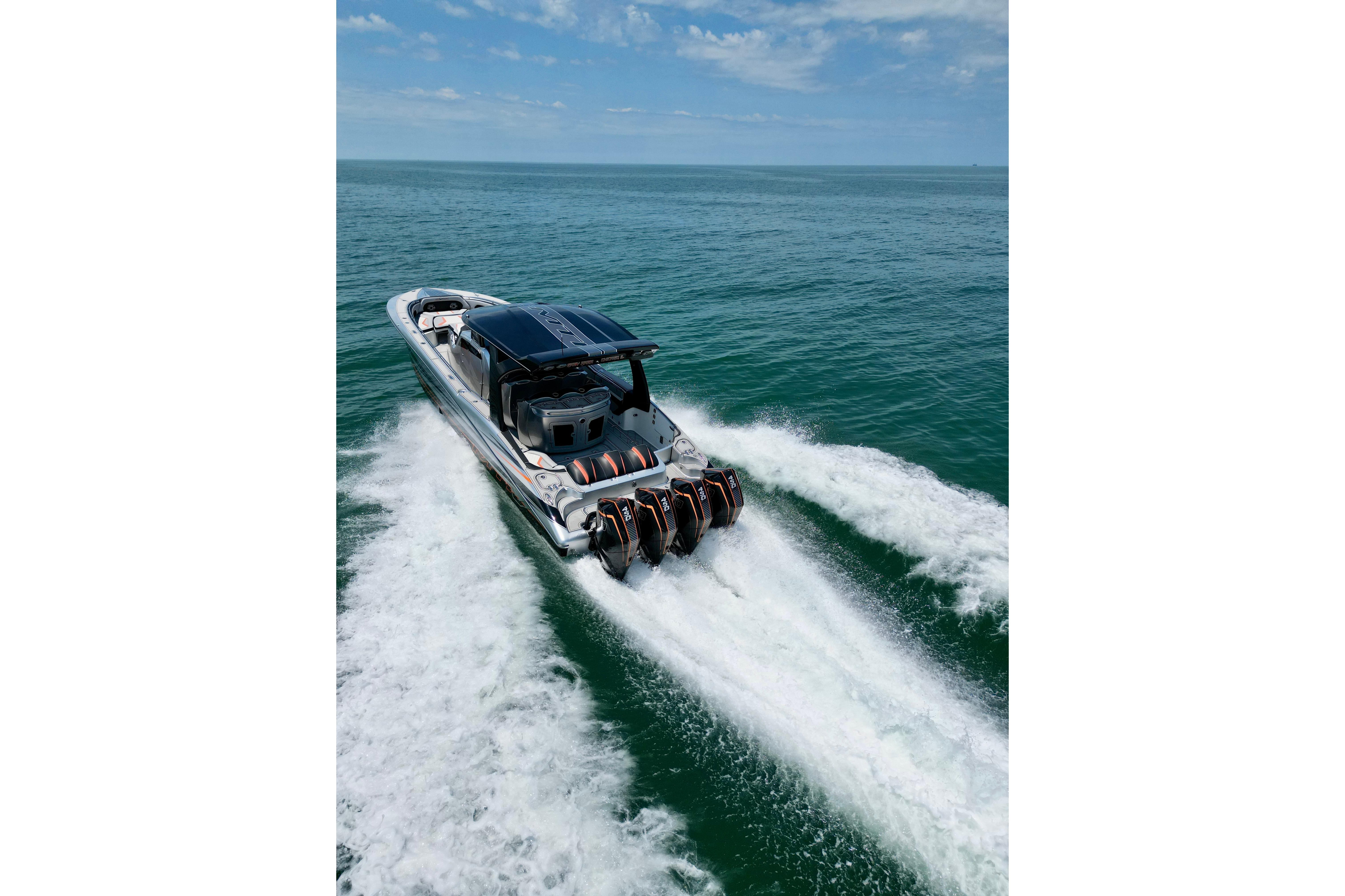 High-performance 2017 MTI V42 boat cruising on open water under a clear sky.