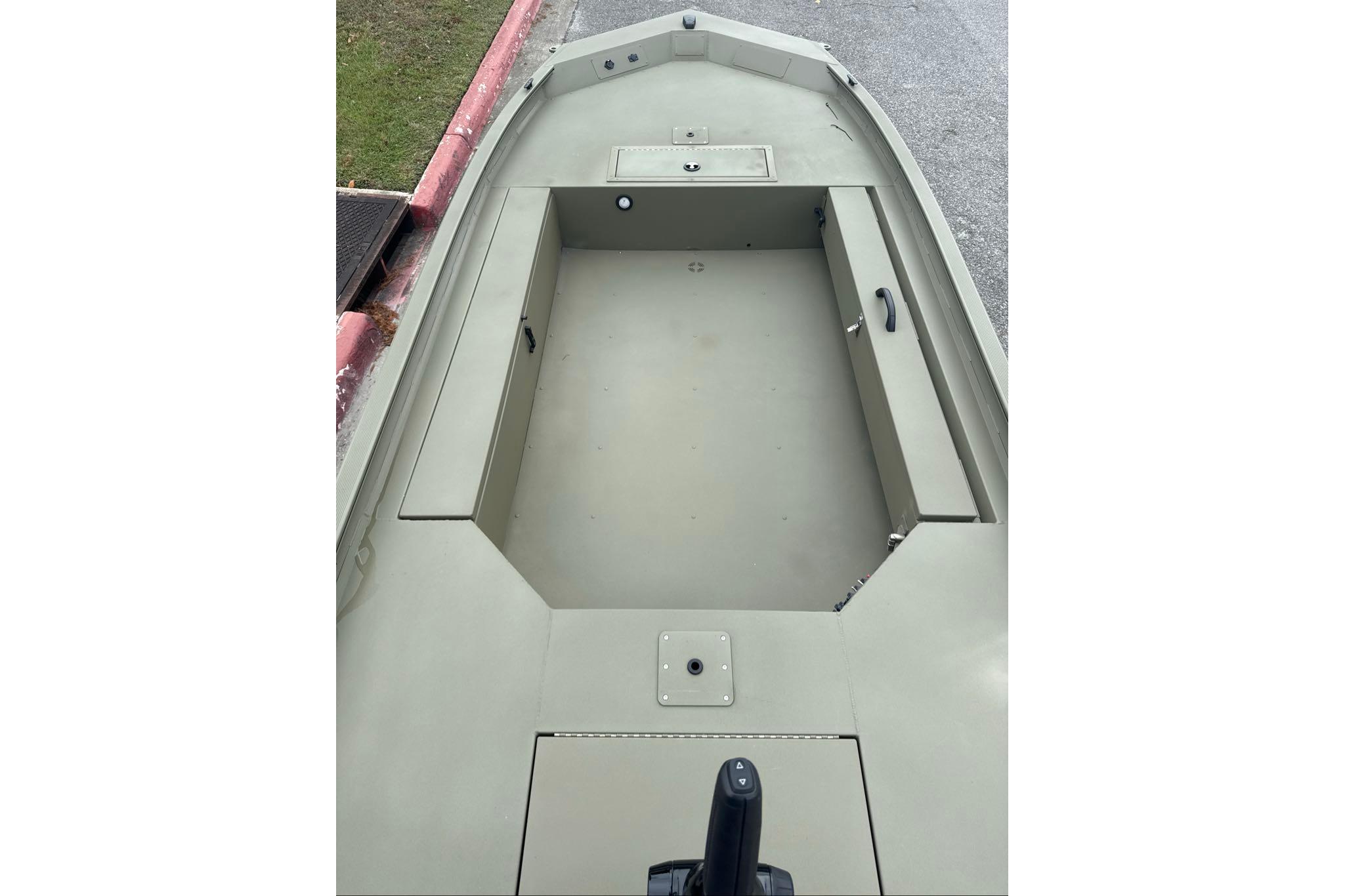 2026 Tracker Grizzly 1654 T Sportsman boat interior, featuring spacious deck and storage compartments.