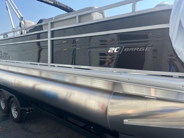 2026 Sun Tracker Fishin' Barge 20 DLX pontoon boat, side view, on trailer.