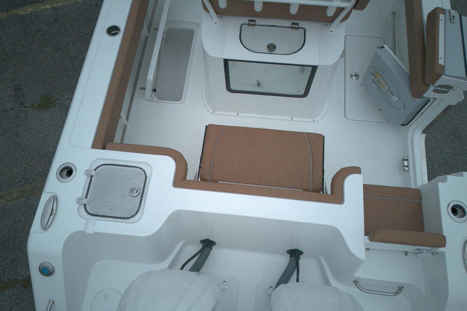 2026 Sea Hunt Gamefish 25 boat interior with seating and storage compartments.