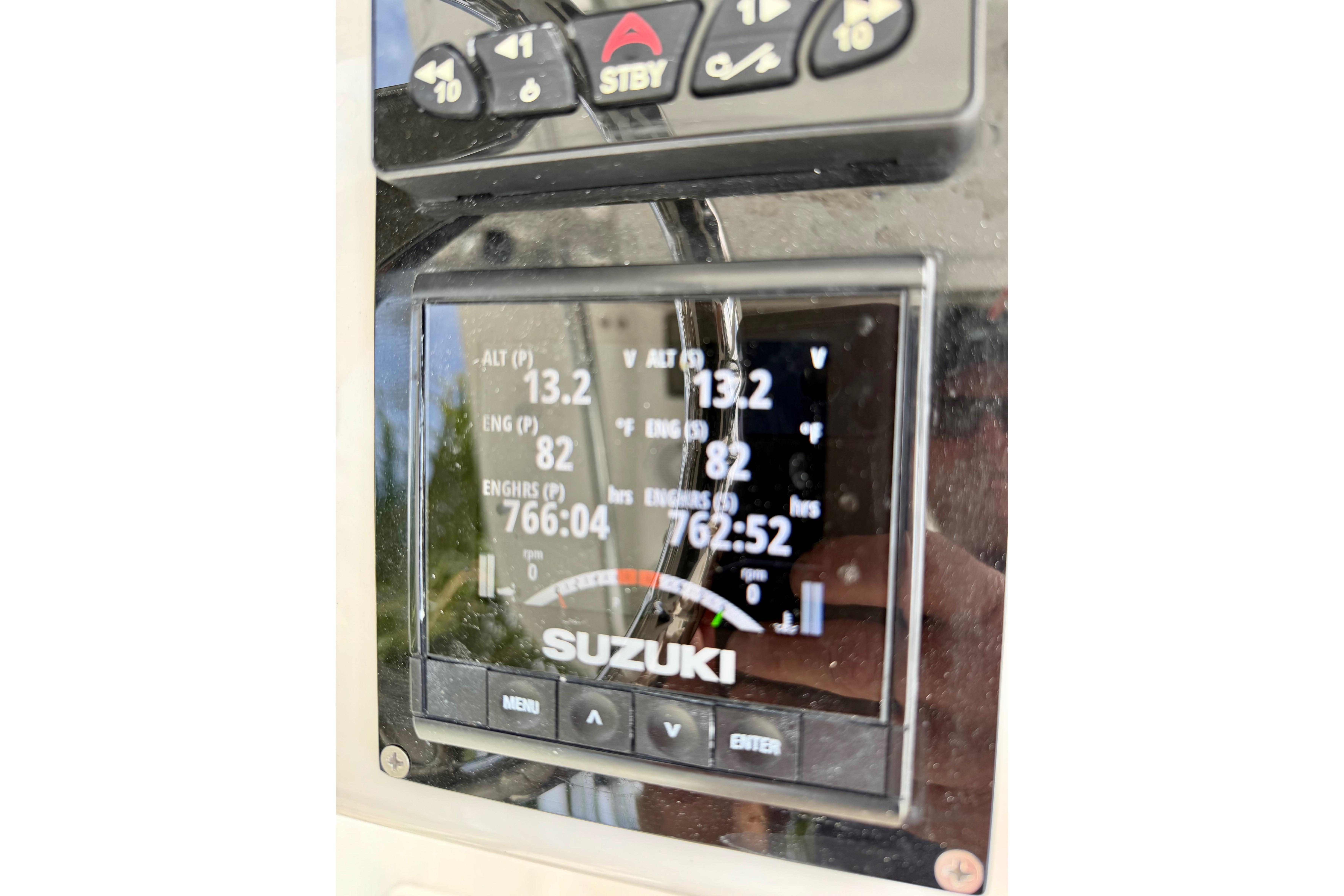 Close-up of Suzuki engine display on 2025 Ocean Master 296 Center Console boat.