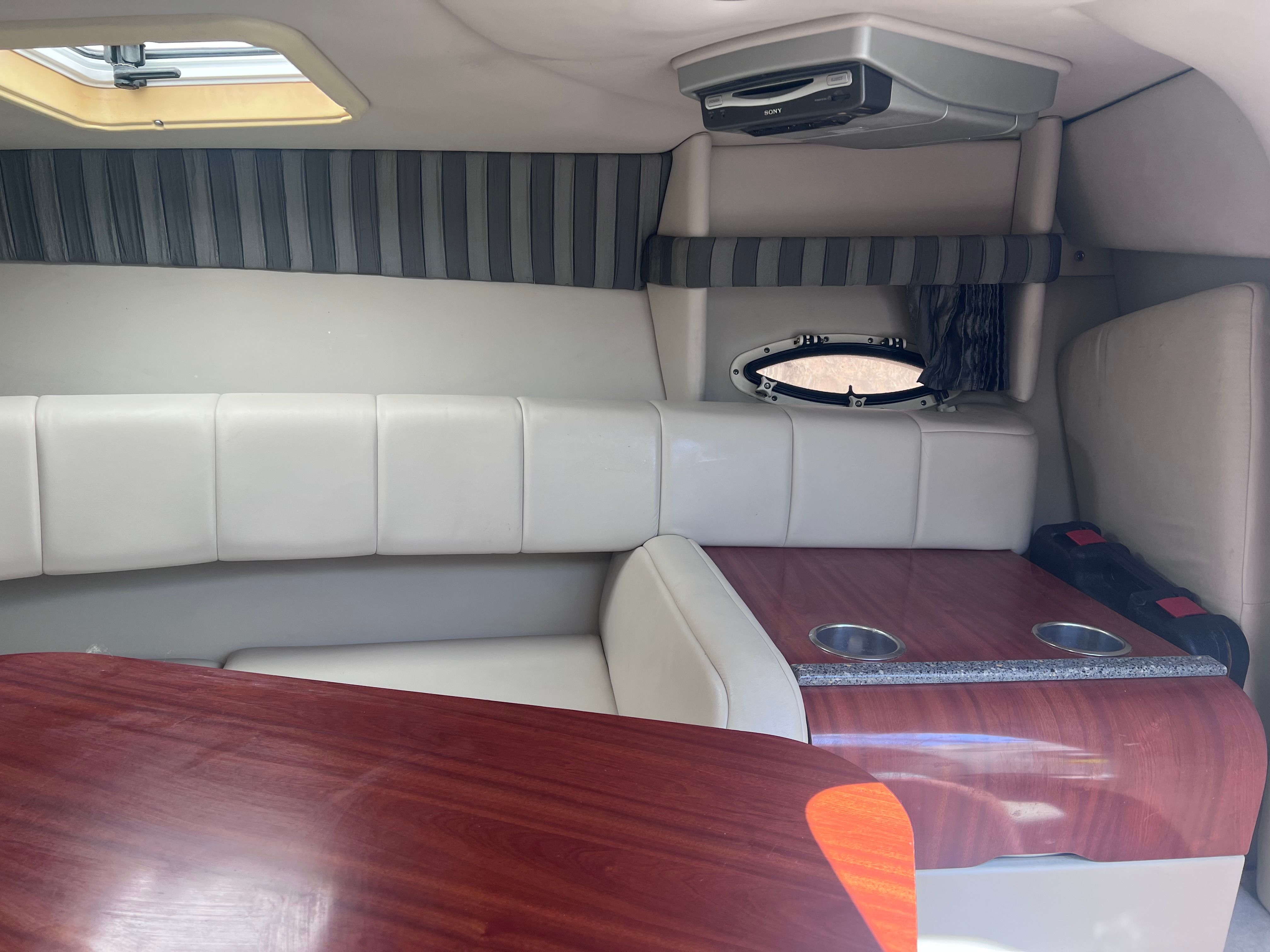 Interior of a 2006 Formula 260 Sun Sport with seating and table.