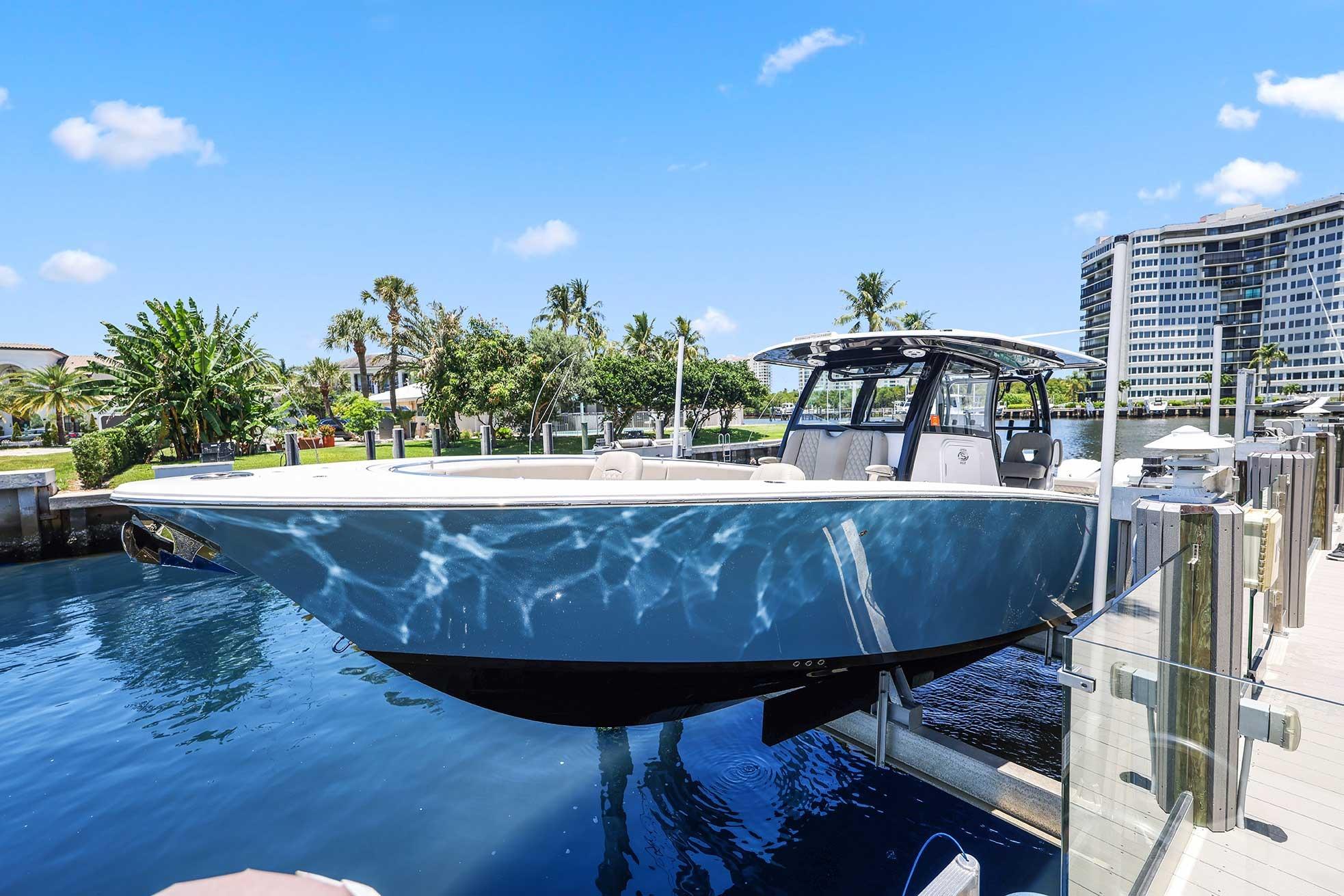 2024 Sportsman Open 352 Center Console boat docked in sunny marina setting.