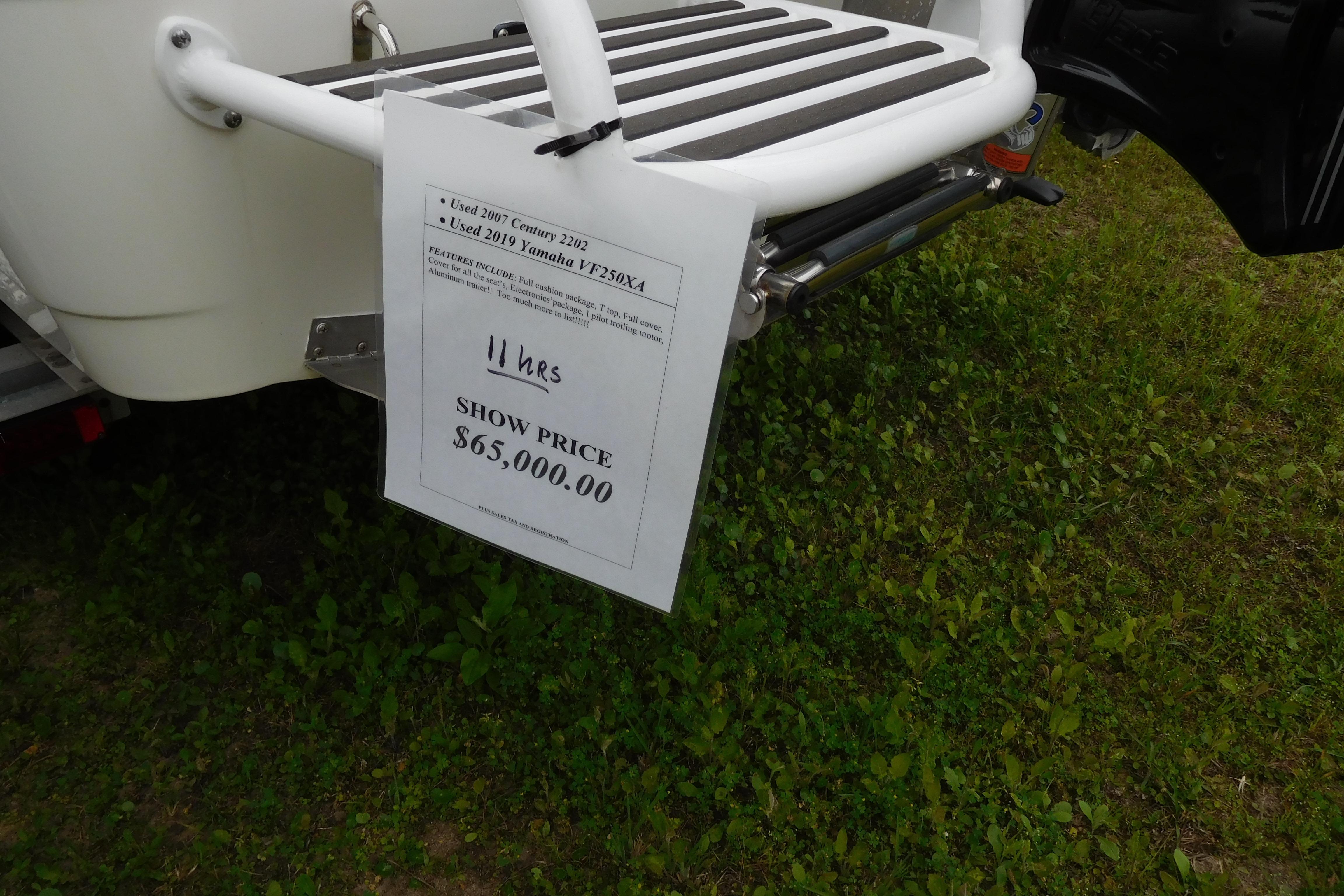 For sale sign on 2007 Century 2202 Inshore boat, priced at $65,000.