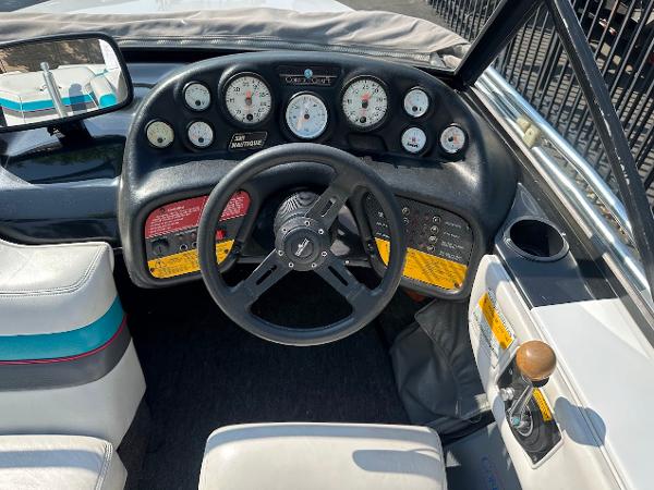 1992 Correct Craft Ski Nautique dashboard with gauges and steering wheel.