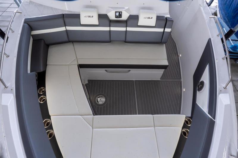 Luxurious seating area on 2022 Cruisers 42 GLS boat, featuring sleek design and modern upholstery.
