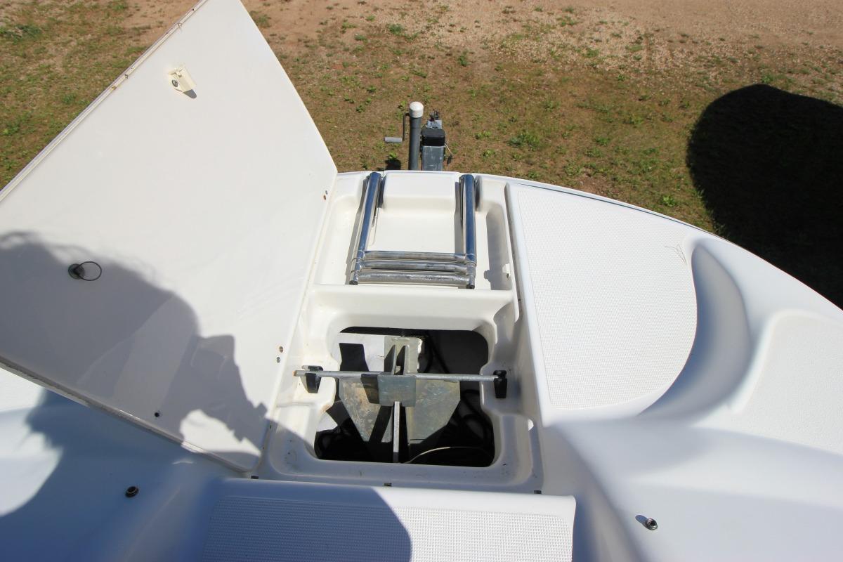 2000 Chris-Craft 232 Sport Deck boat anchor compartment with ladder, open hatch view.