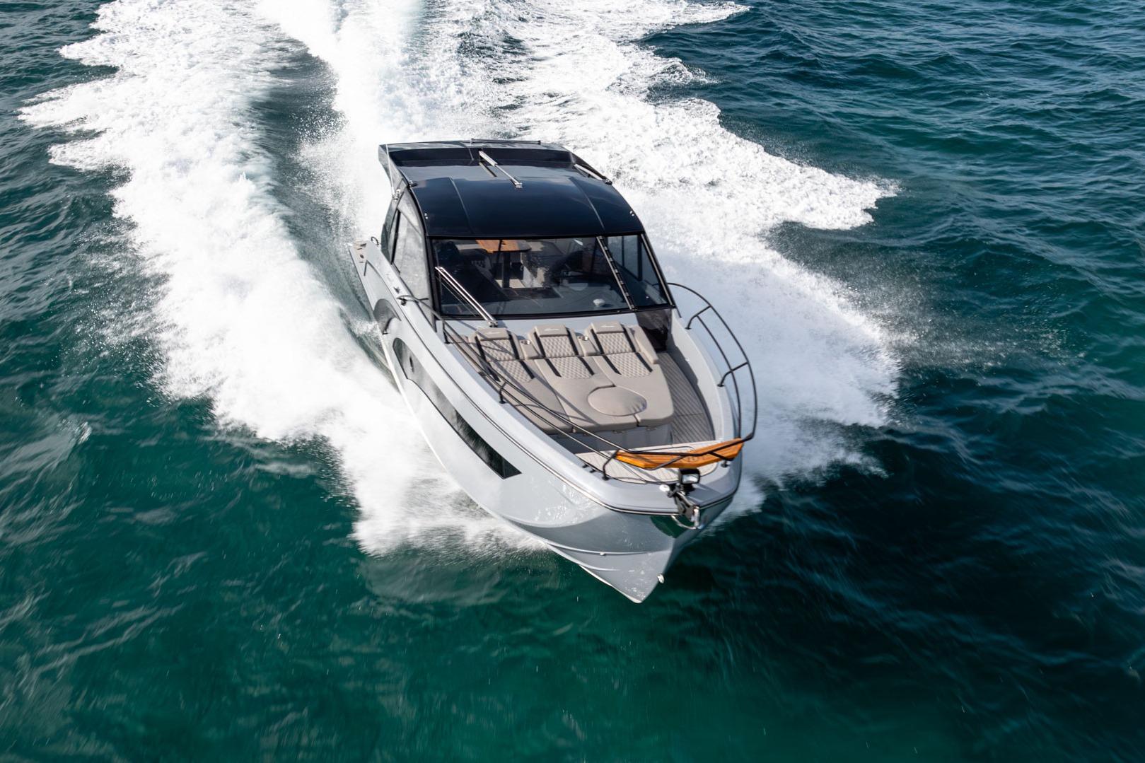 2026 Hanover 387 yacht cruising swiftly on open ocean waters.
