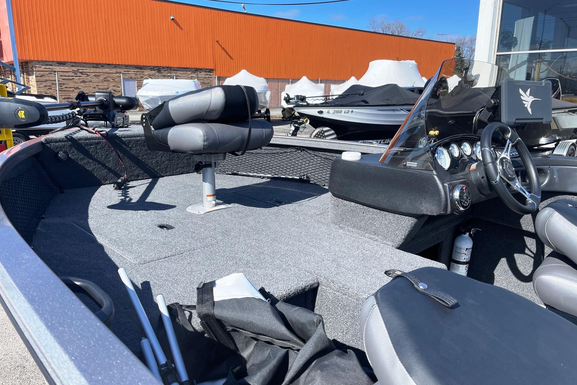 2023 Crestliner 1650 Fish Hawk boat interior with seating and control panel.