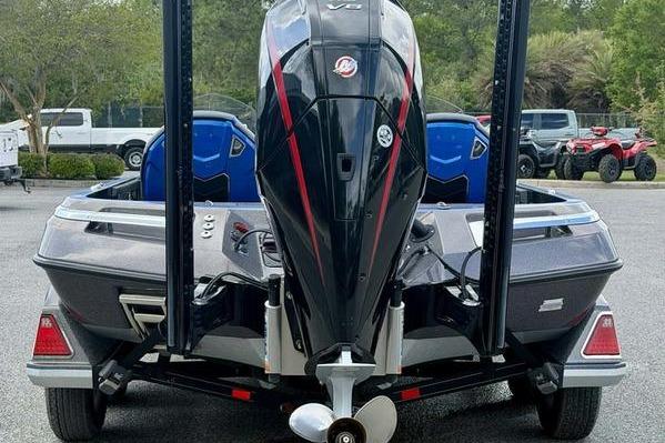 2023 Ranger Z520R boat with powerful outboard motor, parked outdoors.