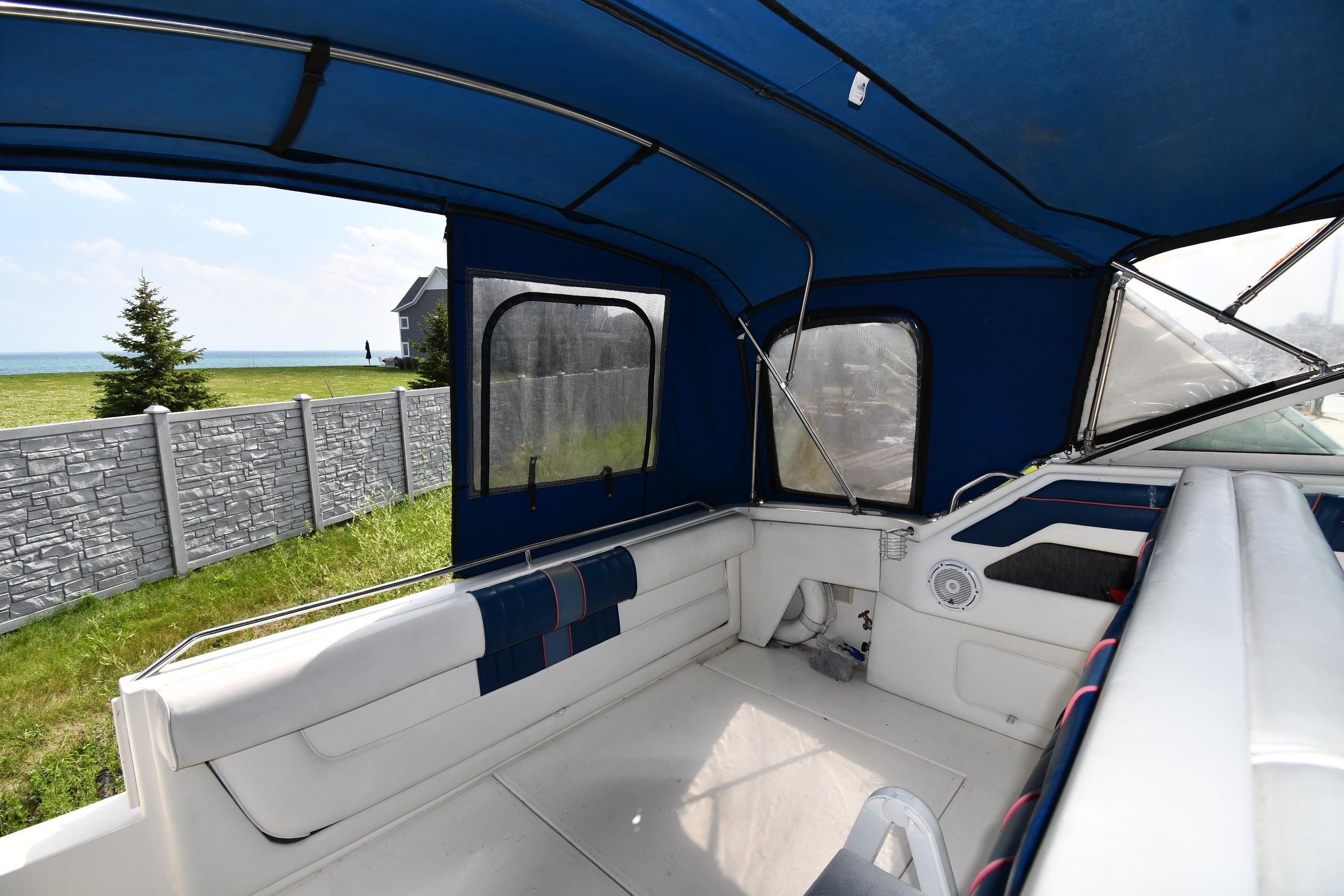 Interior view of 1993 Sea Ray 300 Sundancer boat with blue canopy.