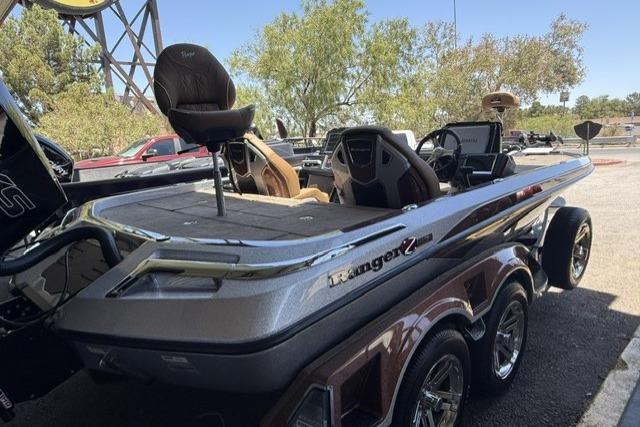 2026 Ranger Z521R Cup-Equipped boat with sleek design and dual seats, parked outdoors.