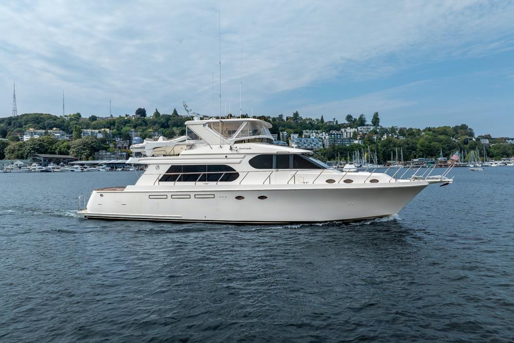 2005 Ocean Alexander 64 Motoryacht cruising on a scenic waterway.