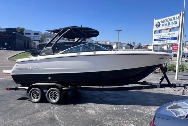 2025 Chaparral 247 SSX boat on trailer at Modern Marine dealership.