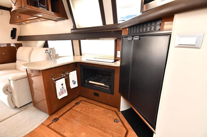 Interior of 2008 Carver 43 Super Sport yacht with kitchenette and seating area.