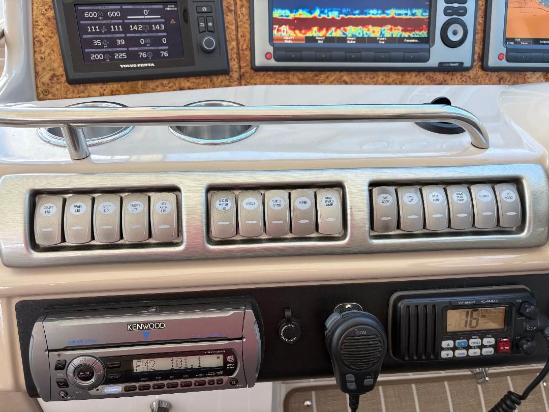 Dashboard of a 2011 Formula 45 with switches, stereo system, and navigation equipment.