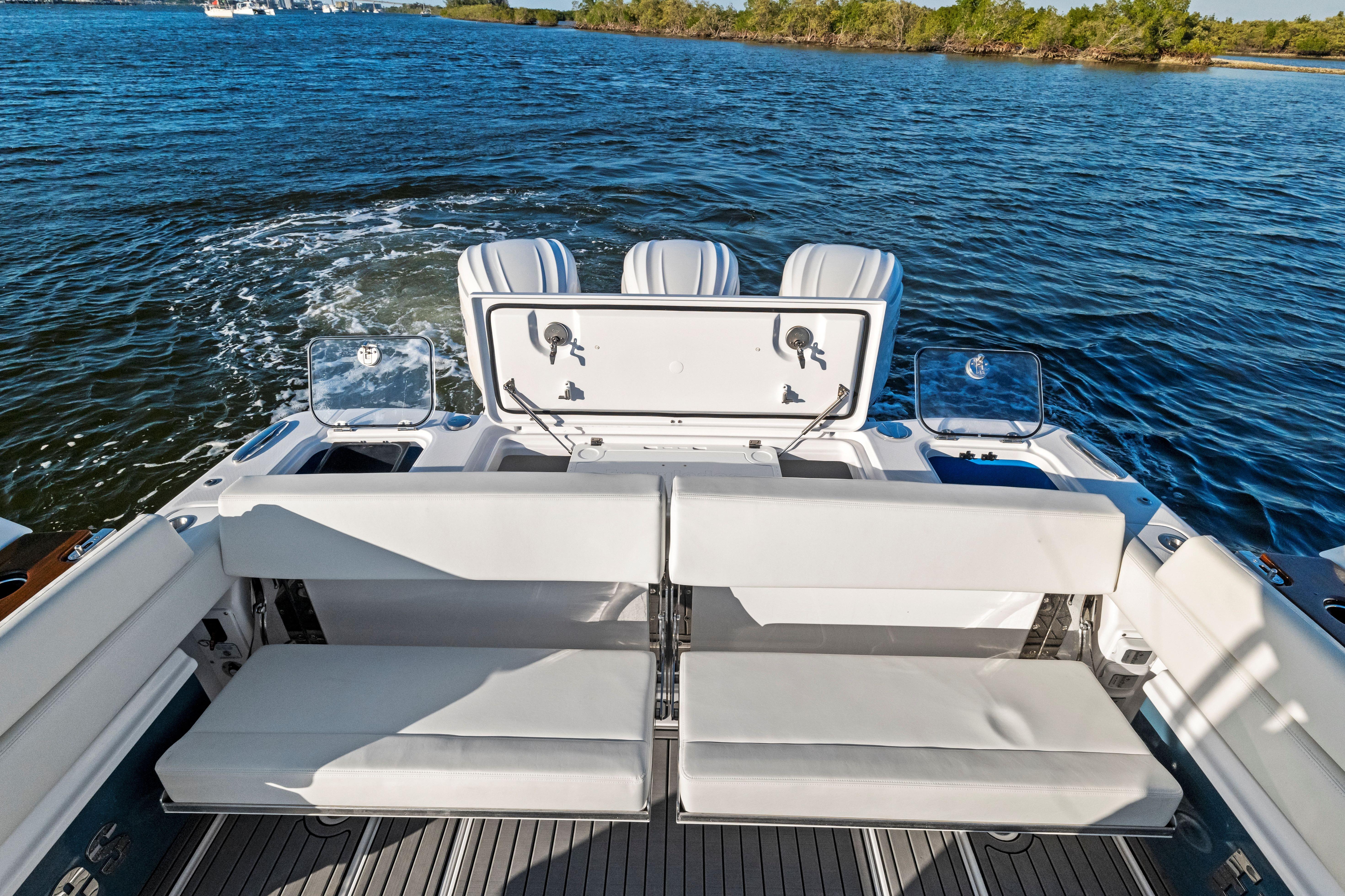 2026 Everglades 375 Center Console boat with spacious seating and scenic water view.