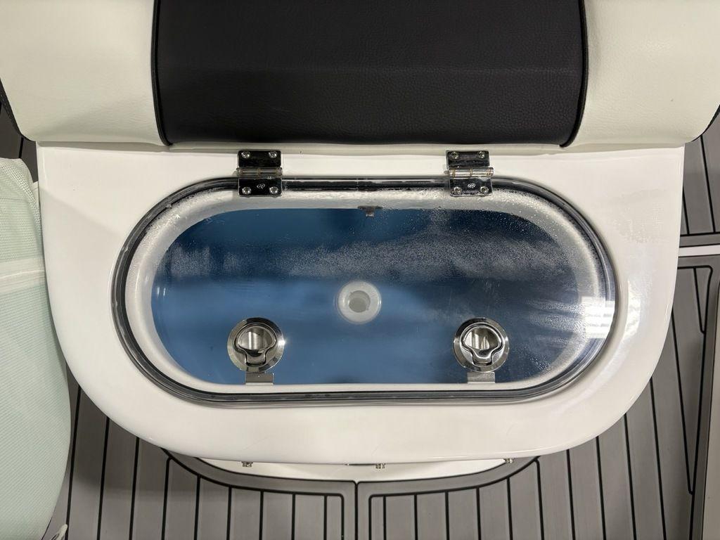 2026 Tidewater 2700 CB boat livewell with transparent lid and secure latches.