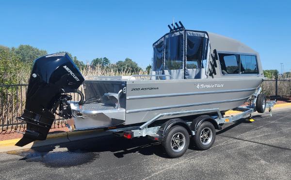 2025 Spartan 200 Astoria boat on trailer, featuring sleek design and powerful outboard motor.