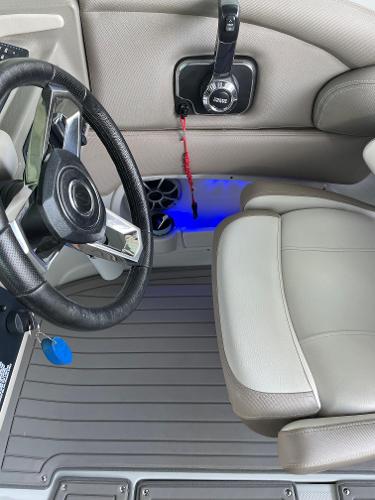 2019 Crownline E255 boat interior with steering wheel and seating.