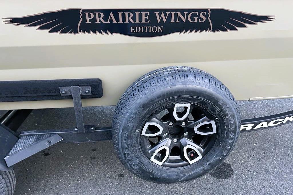 2026 Tracker Grizzly 1650 T Prairie Wings Edition tire and logo detail.