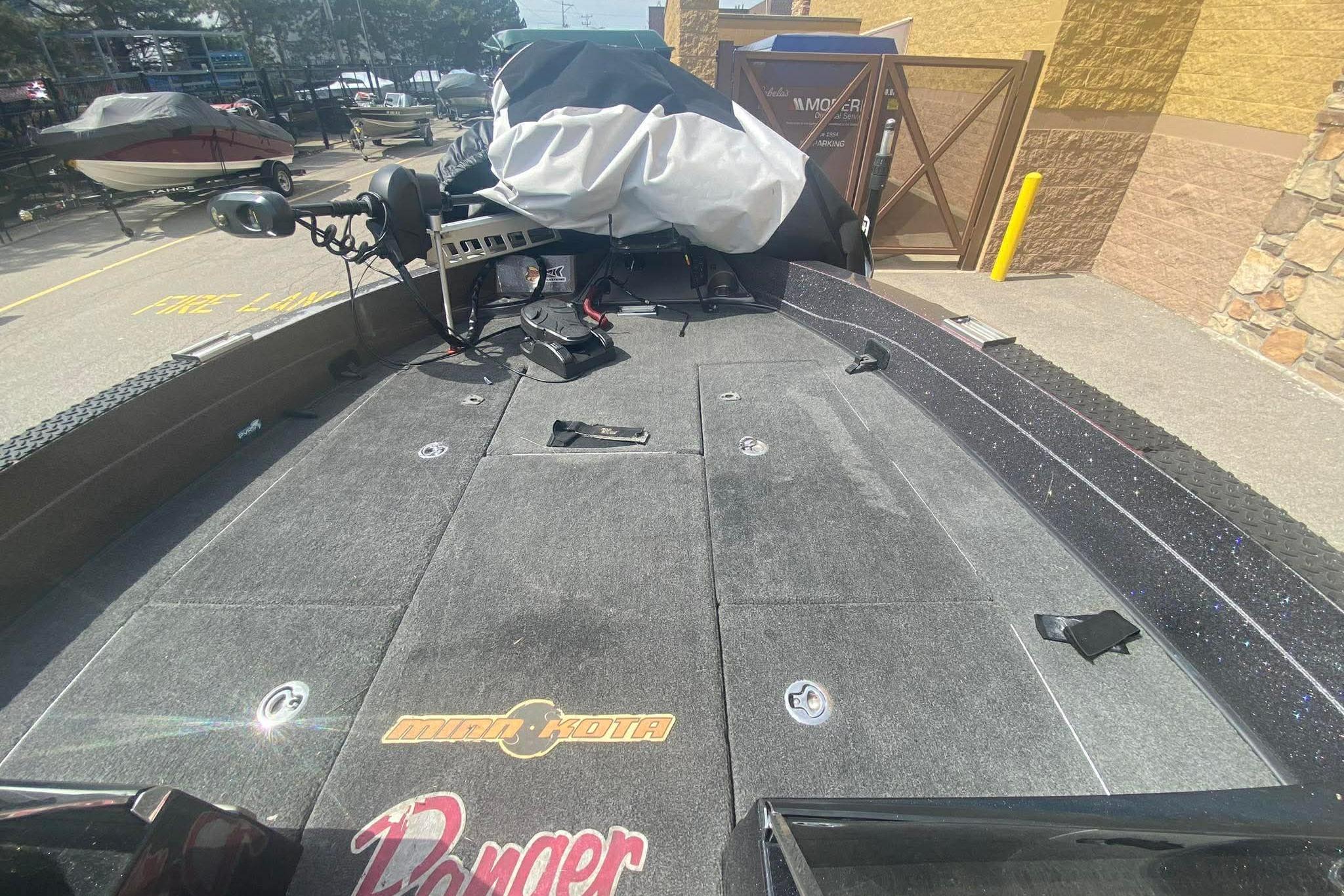 2017 Ranger 621FS Fisherman boat deck with Minn Kota trolling motor, parked outdoors.