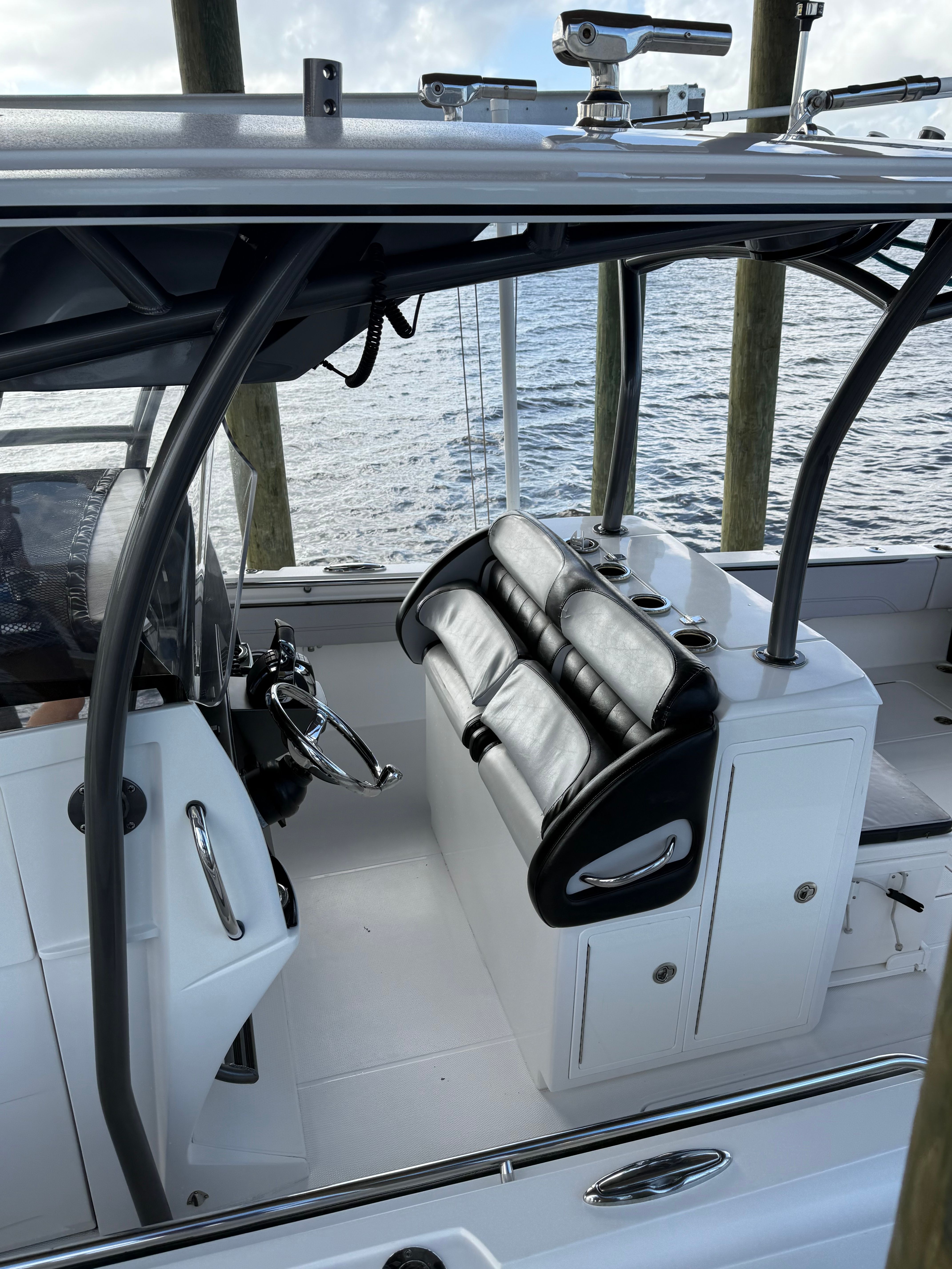 Interior of a 2018 Nor-Tech 392 Super Fish boat by the water.
