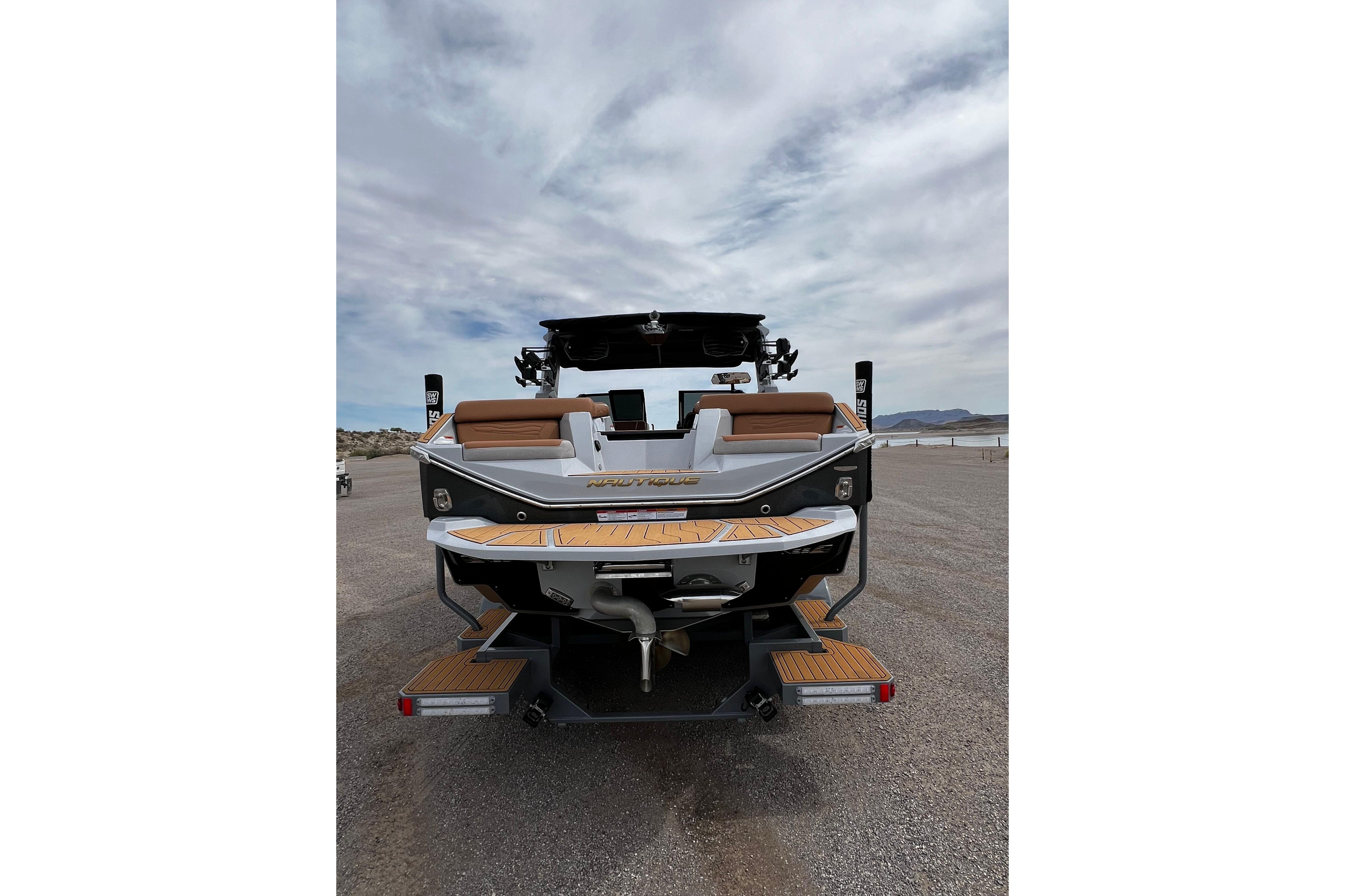 2026 Nautique Super Air Nautique G25 boat rear view on a sunny day.