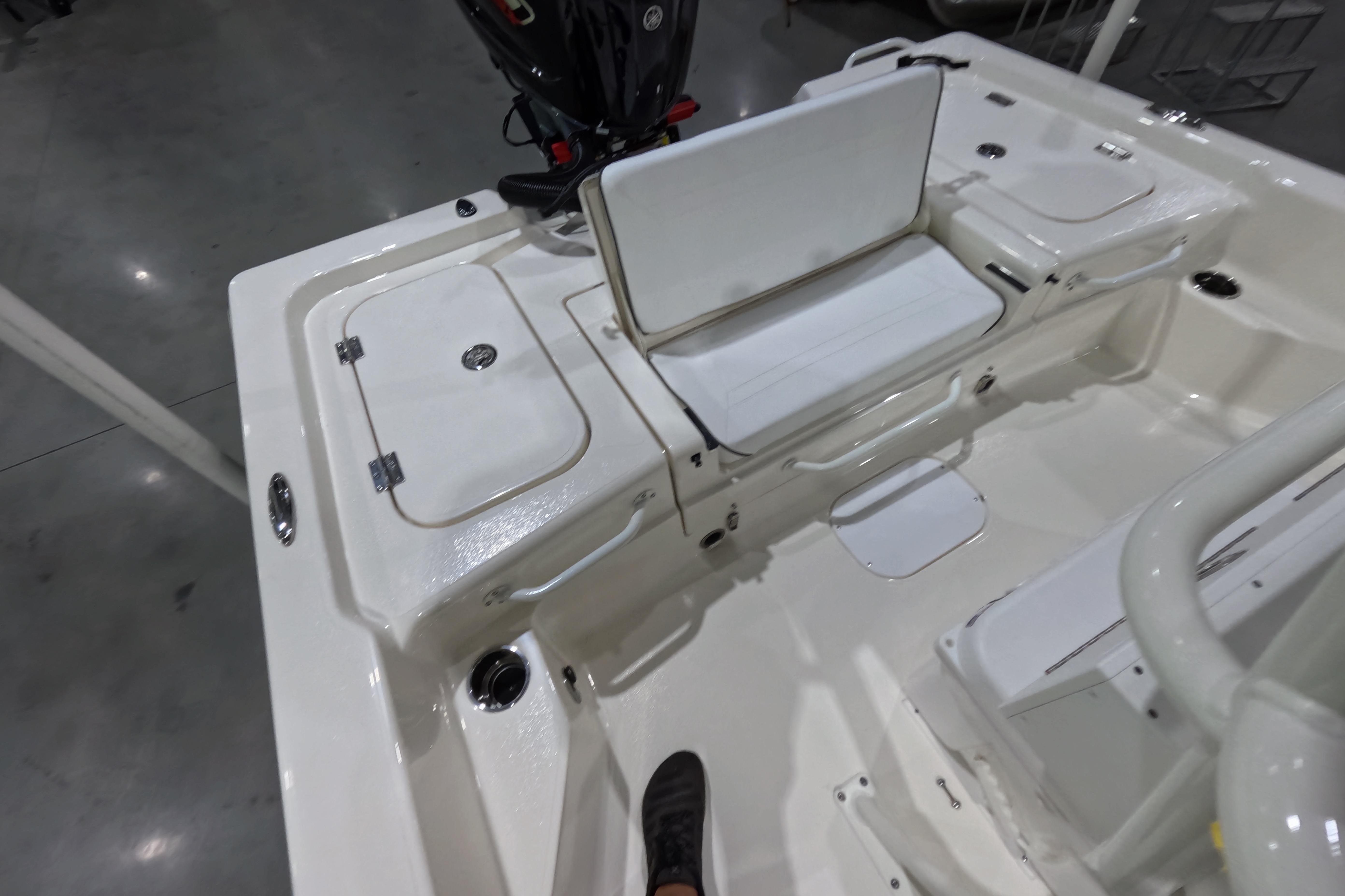 2026 Skeeter boat interior with storage compartments and seating, showcasing sleek design and functionality.