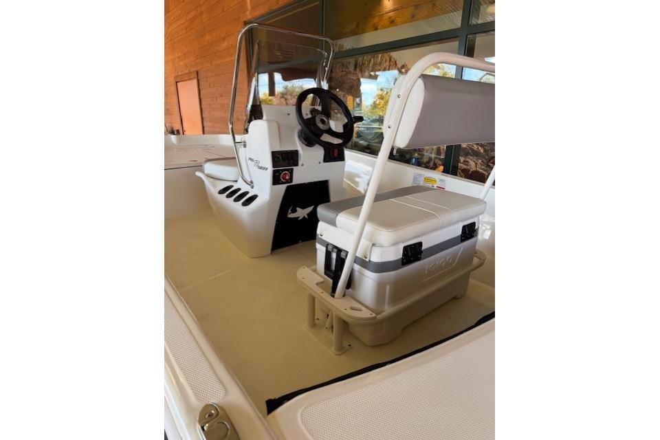 2026 Mako Pro Skiff 17 CC interior with steering console and seating.