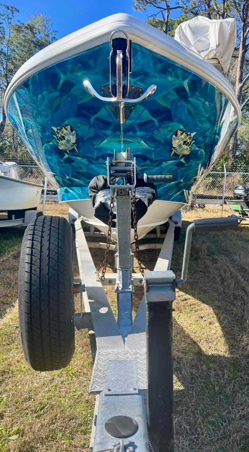 2021 Intrepid 327 Nomad boat on trailer, front view.