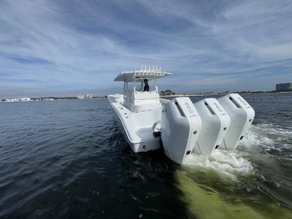 2025 Yellowfin 39 Offshore boat cruising on open water with triple engines.