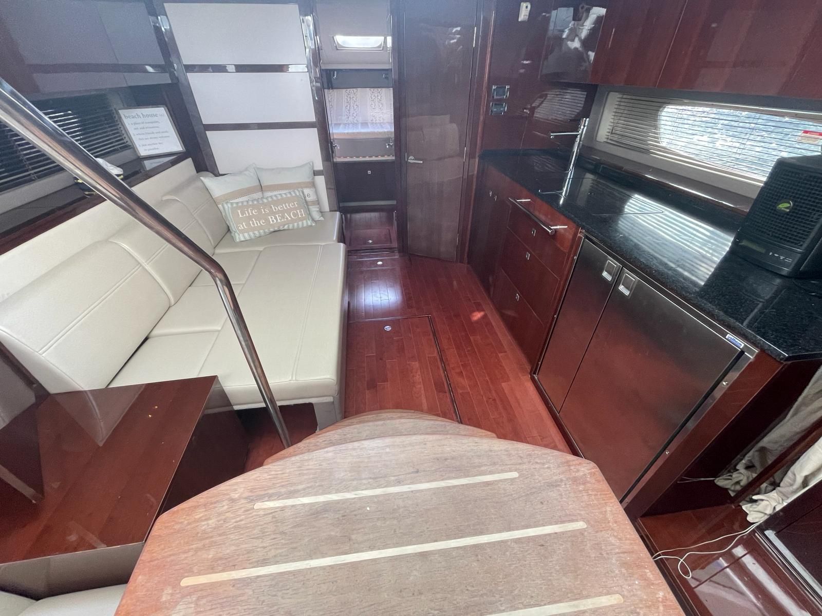 Interior of a 2010 Sea Ray 450 yacht with modern kitchen.