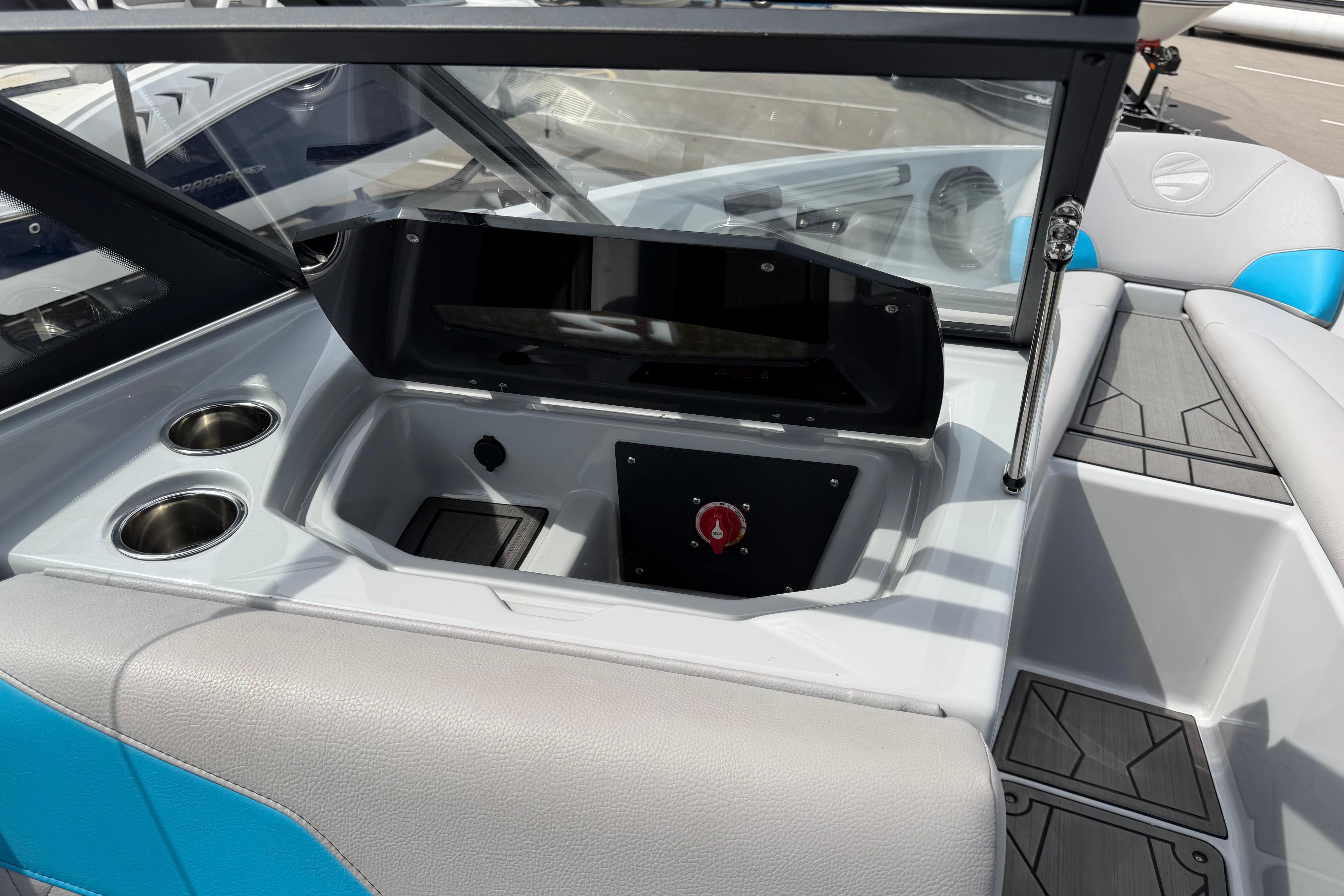 2024 Tigé Z1 boat interior with cup holders and control panel.