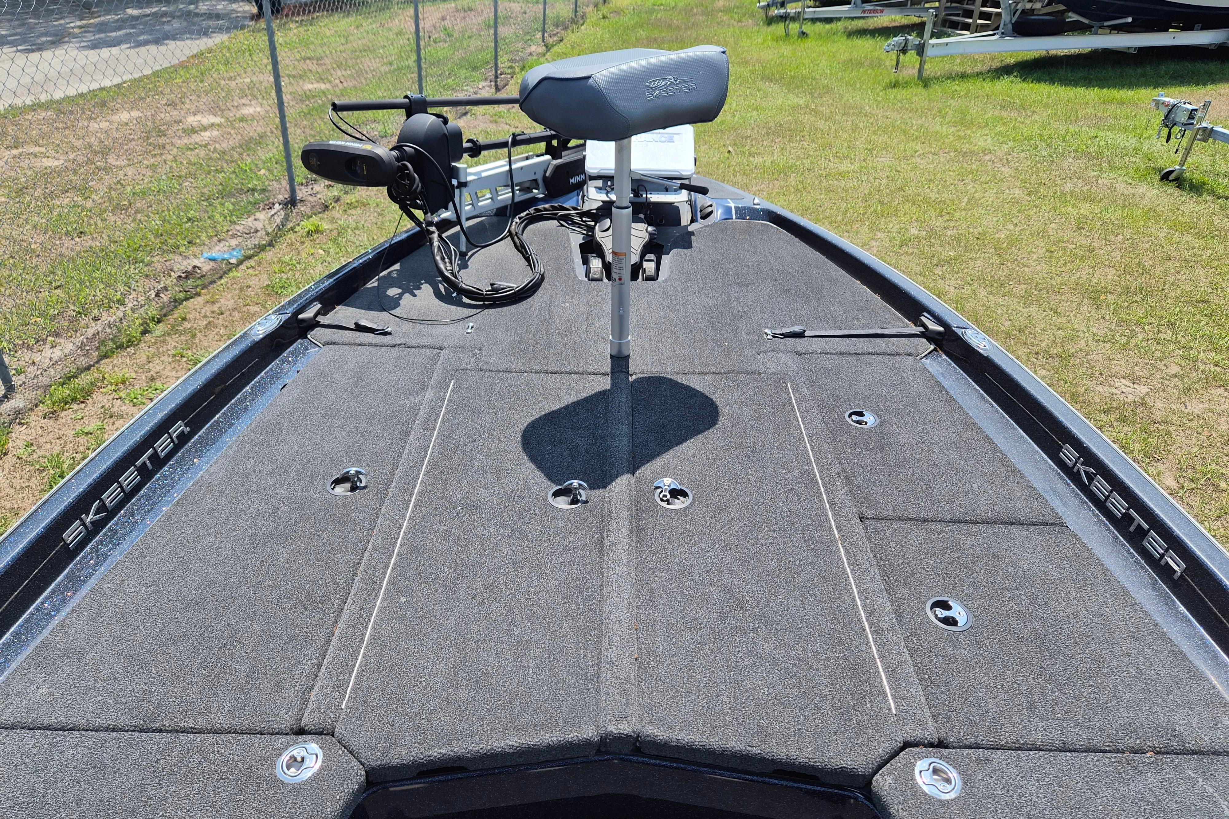 2021 Skeeter ZXR20 boat deck with seat and trolling motor.
