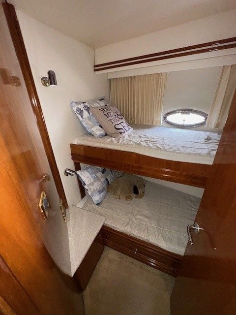 Interior of 2002 Carver 570 Voyager Pilothouse with bunk beds.