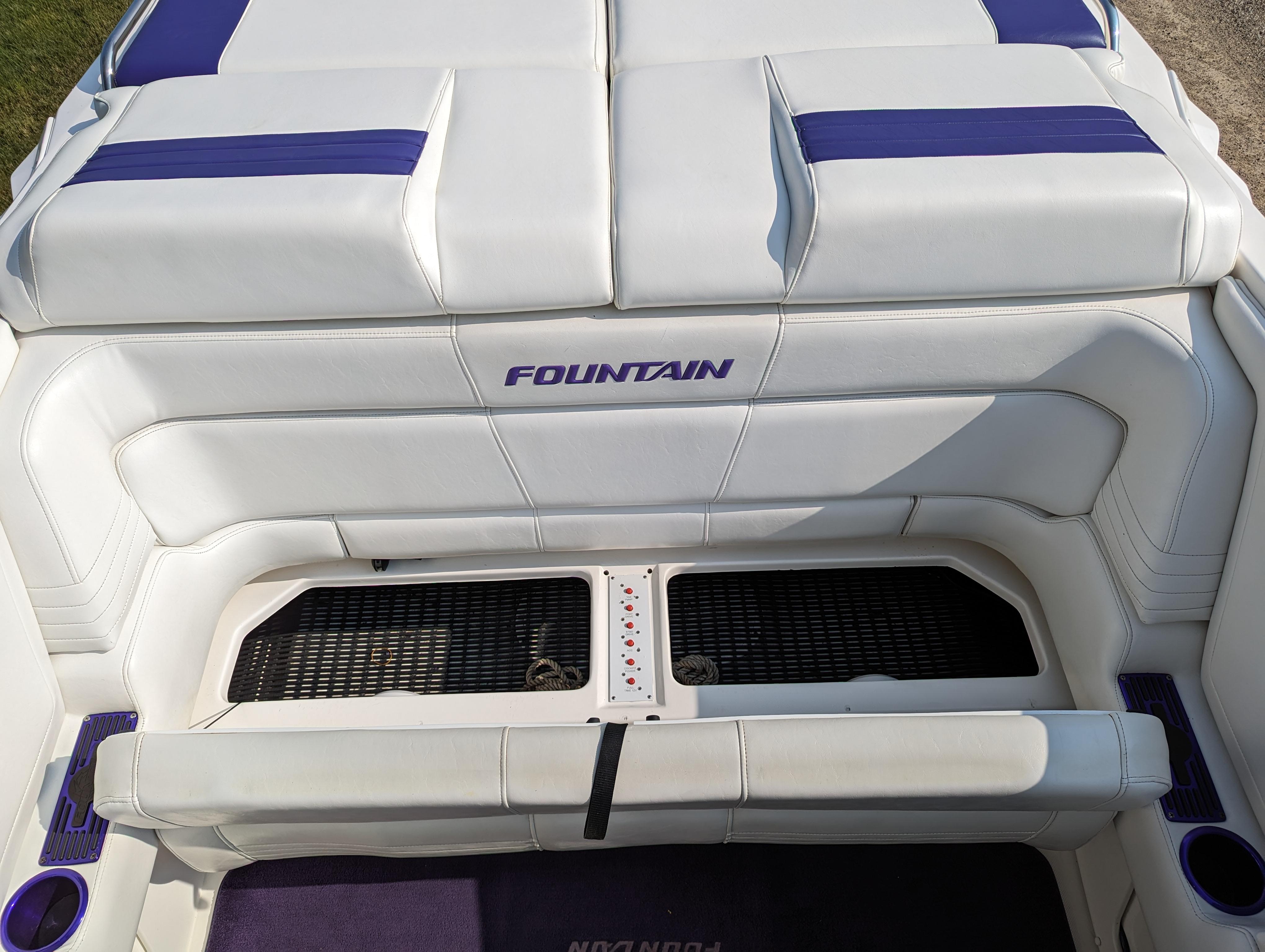 2006 Fountain 42 boat interior with white and blue seating.