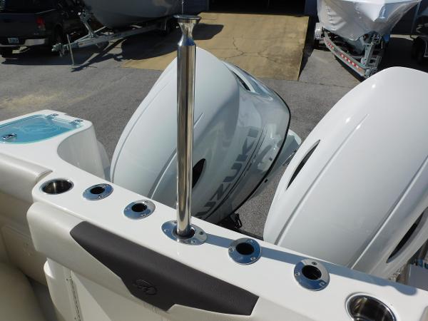 2024 Sailfish 242 CC boat with dual Suzuki outboard engines.
