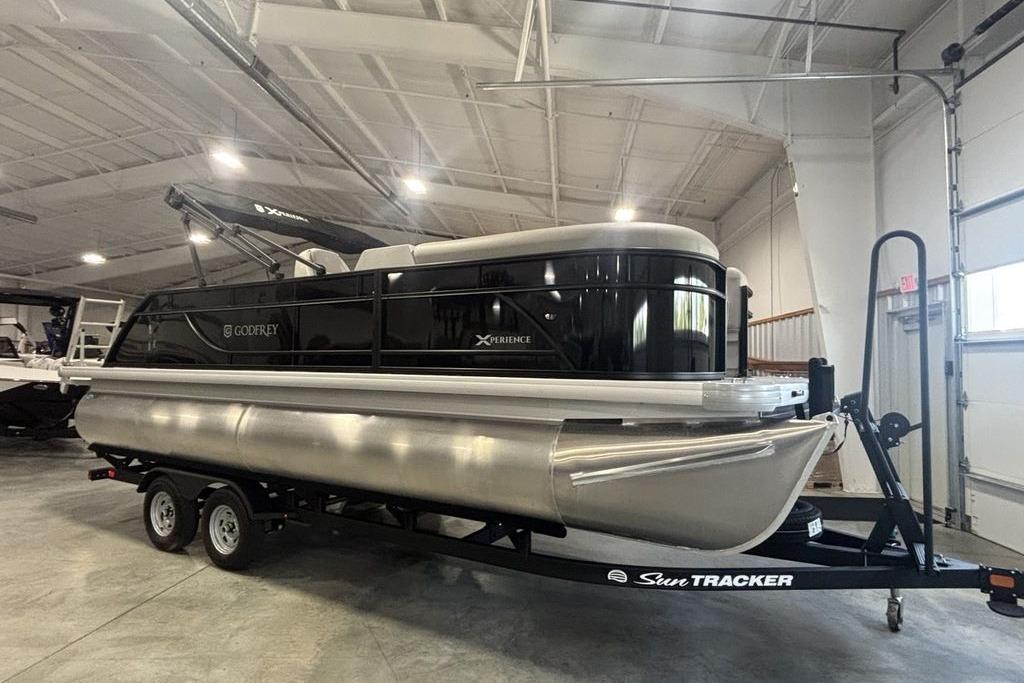 2026 Godfrey Xperience 2086 SFLX pontoon boat on trailer in indoor showroom.