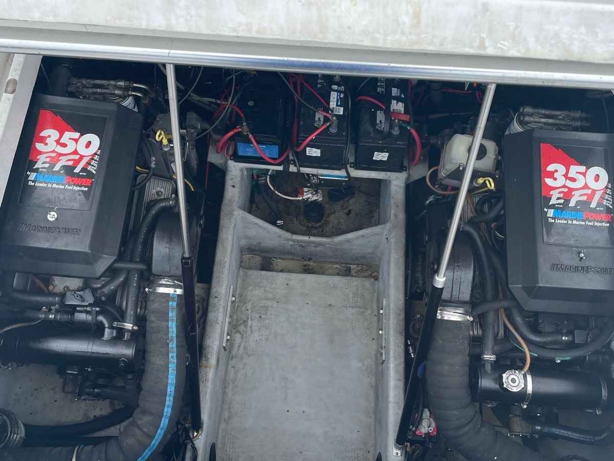 Engine compartment of a 1998 Mainship 31 Sedan Bridge with two 350 EFI engines.
