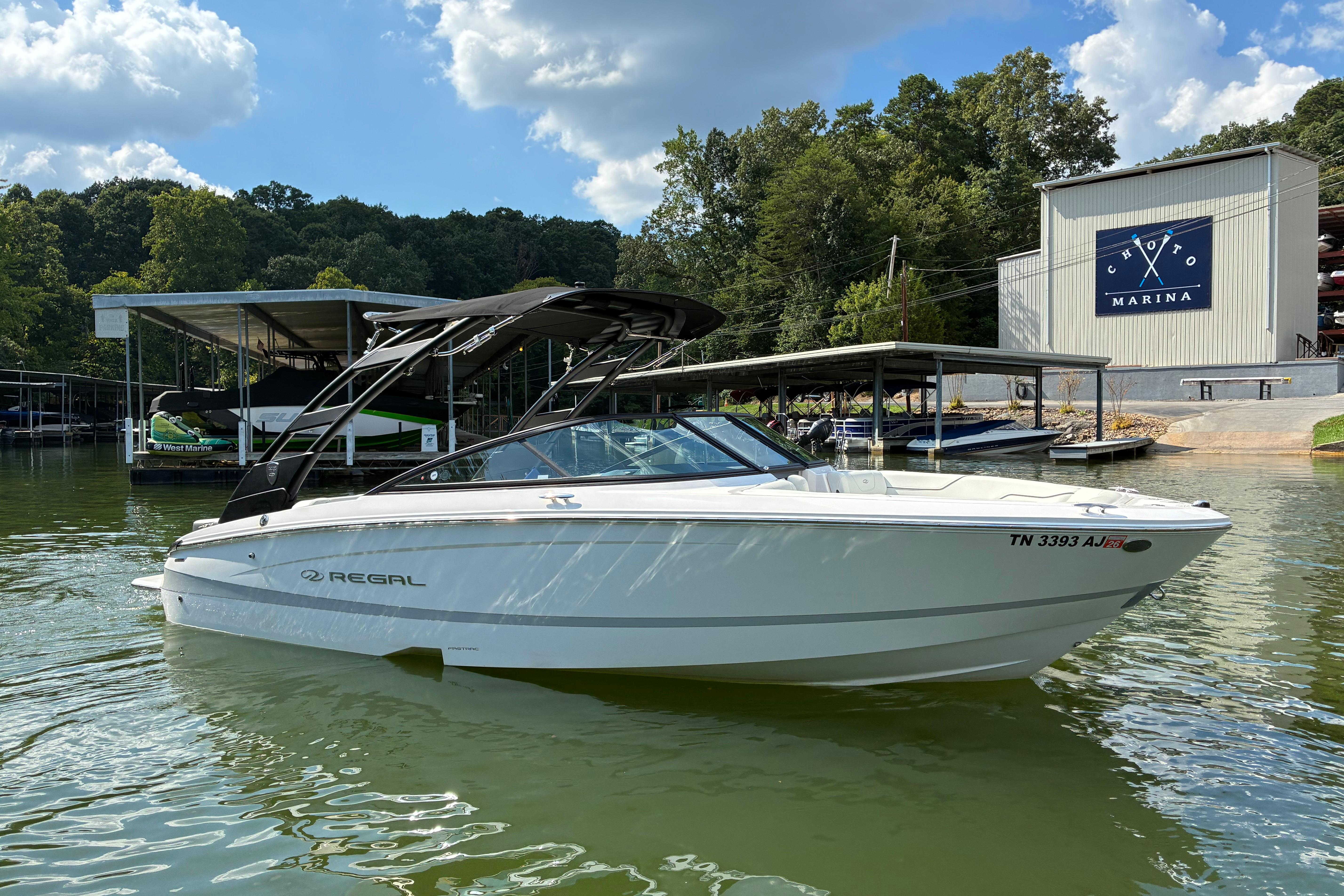 2025 Regal LS2 boat docked at Choto Marina under a sunny sky.