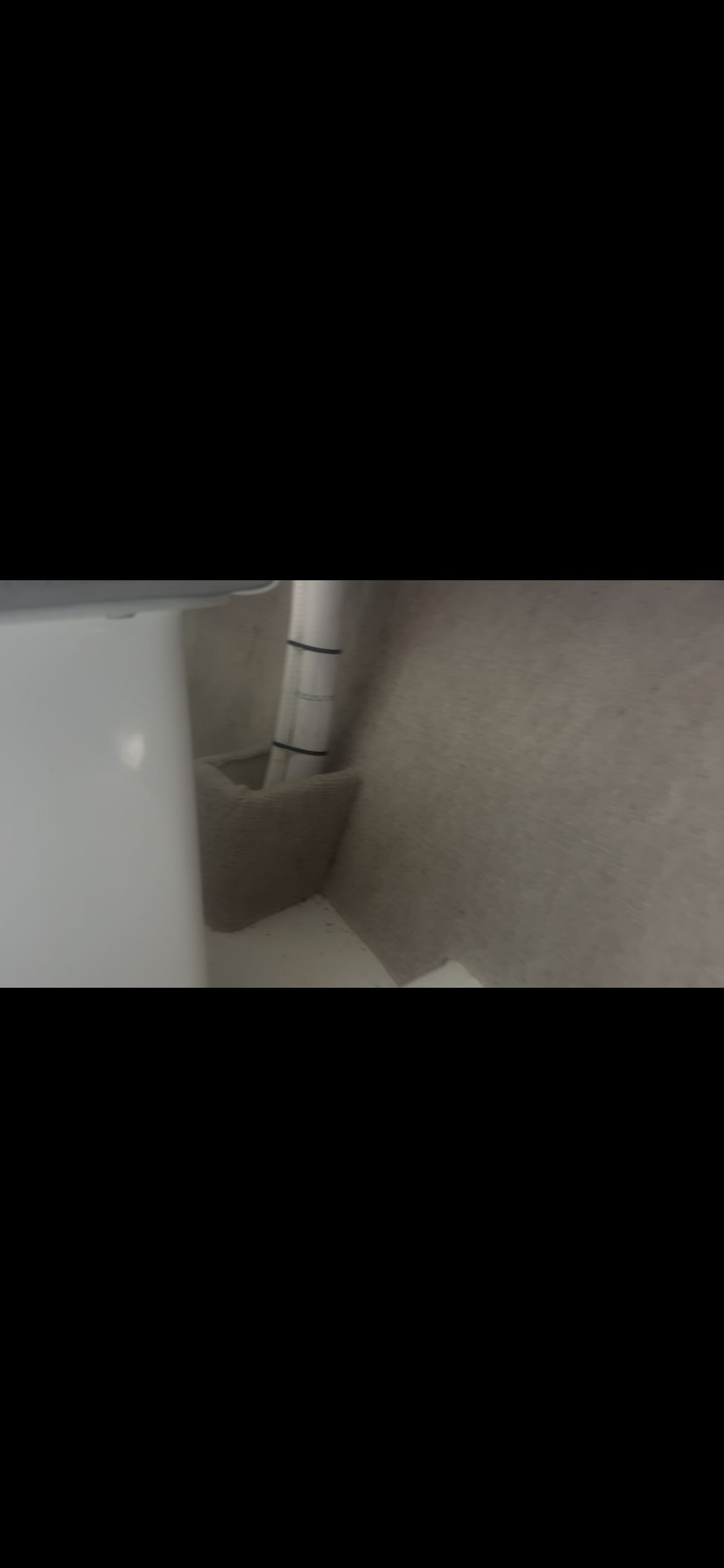 Interior of a Parker 2320 Sport Cabin boat with a pipe and wall.